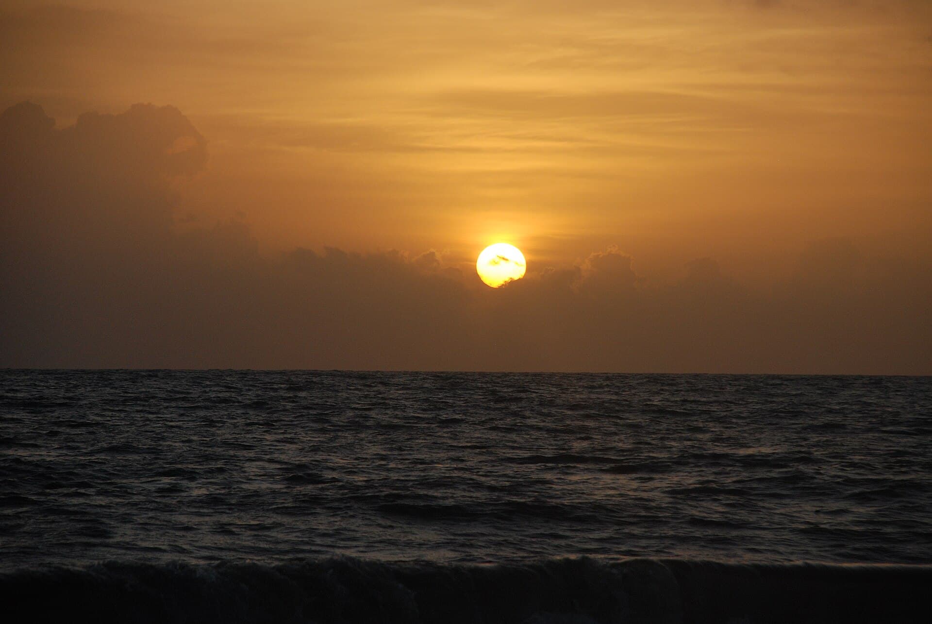 Sunset over the sea at Mararikulam beach