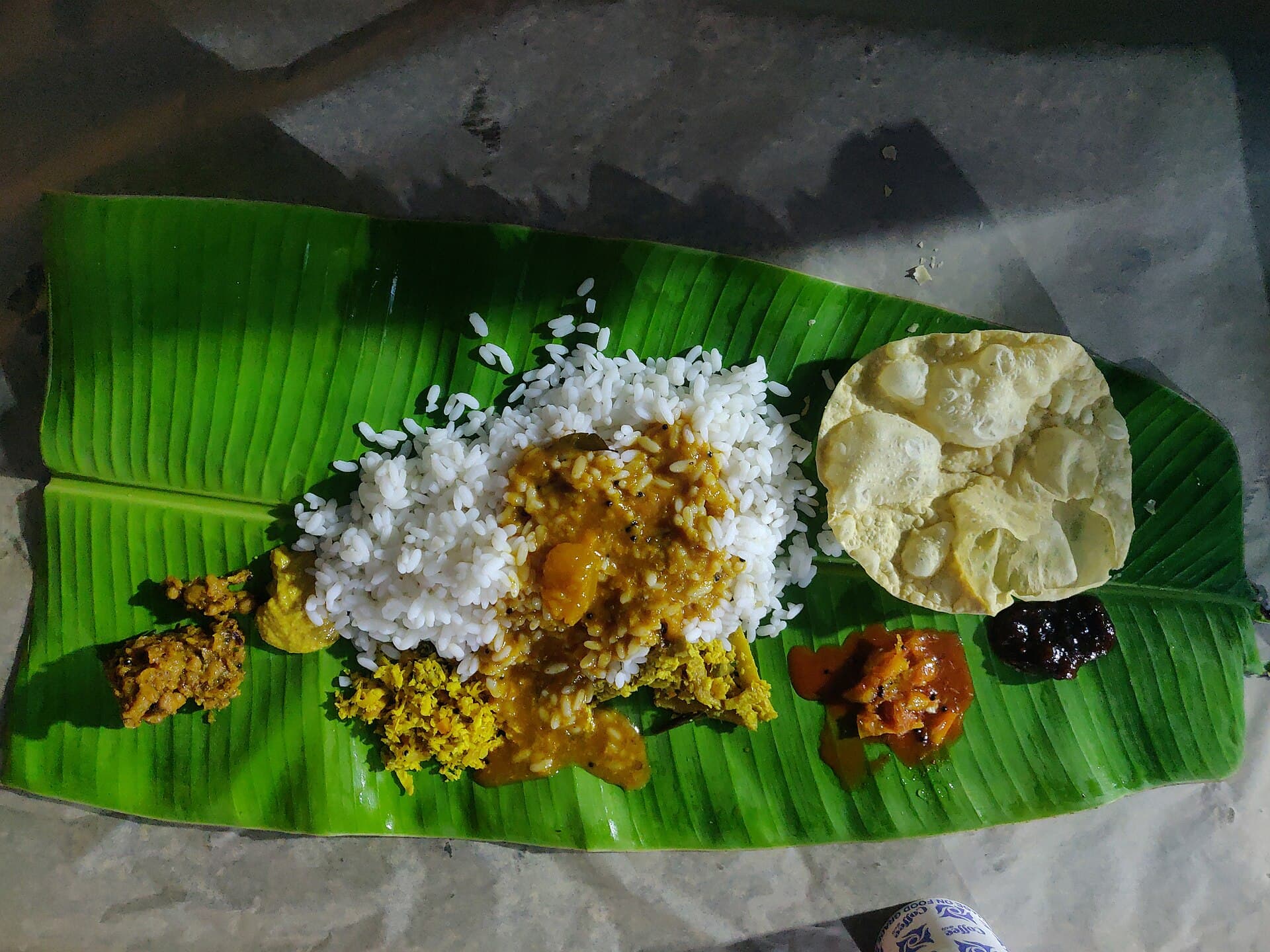 A traditional Kerala sadya feast served on a banana leaf